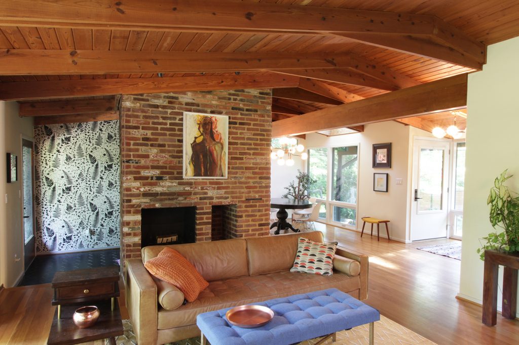 Interior view of roomy, modern, light filled, mid-century modern dining room and cathedral ceiling