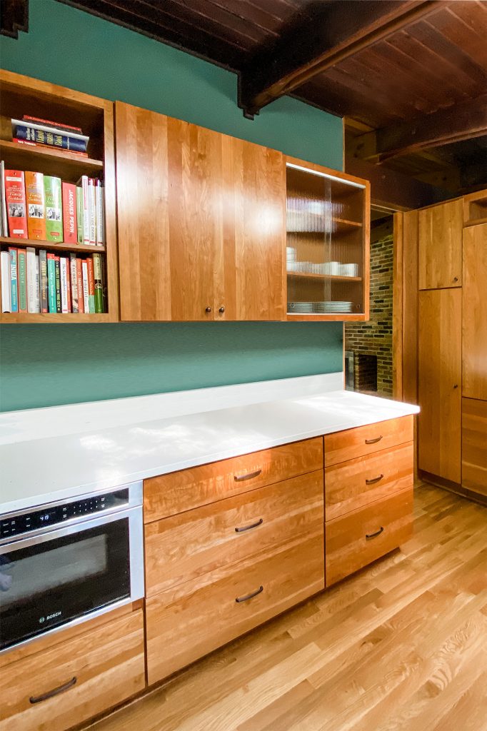 View of kitchen retro inspired cabinetry provided in this whole house renovation