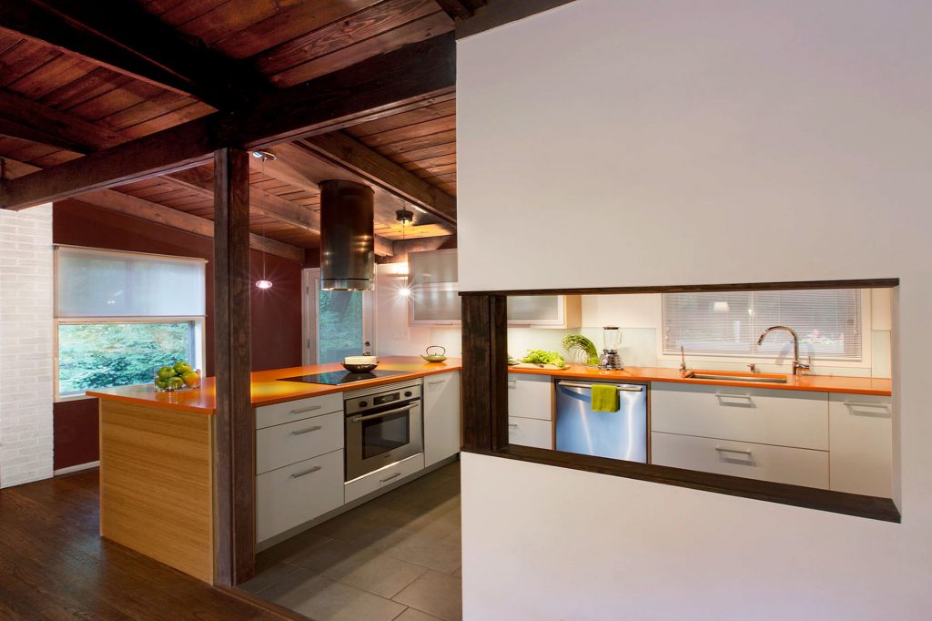 View of renovated kitchen from living room for this home expansion