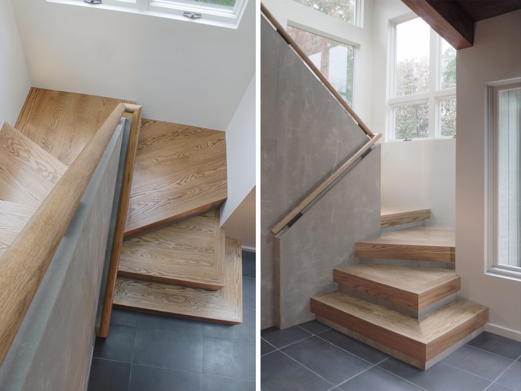 View of new main stair home renovation from top and bottom landings