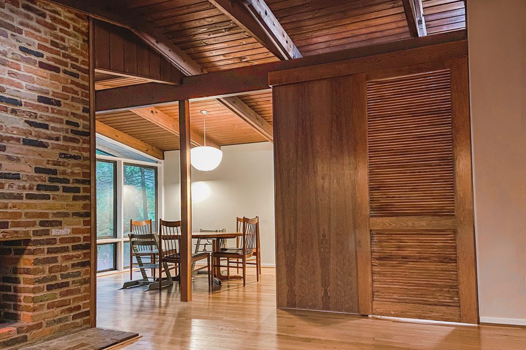 View of newly opened dining room and new kitchen door provided by this whole house renovation