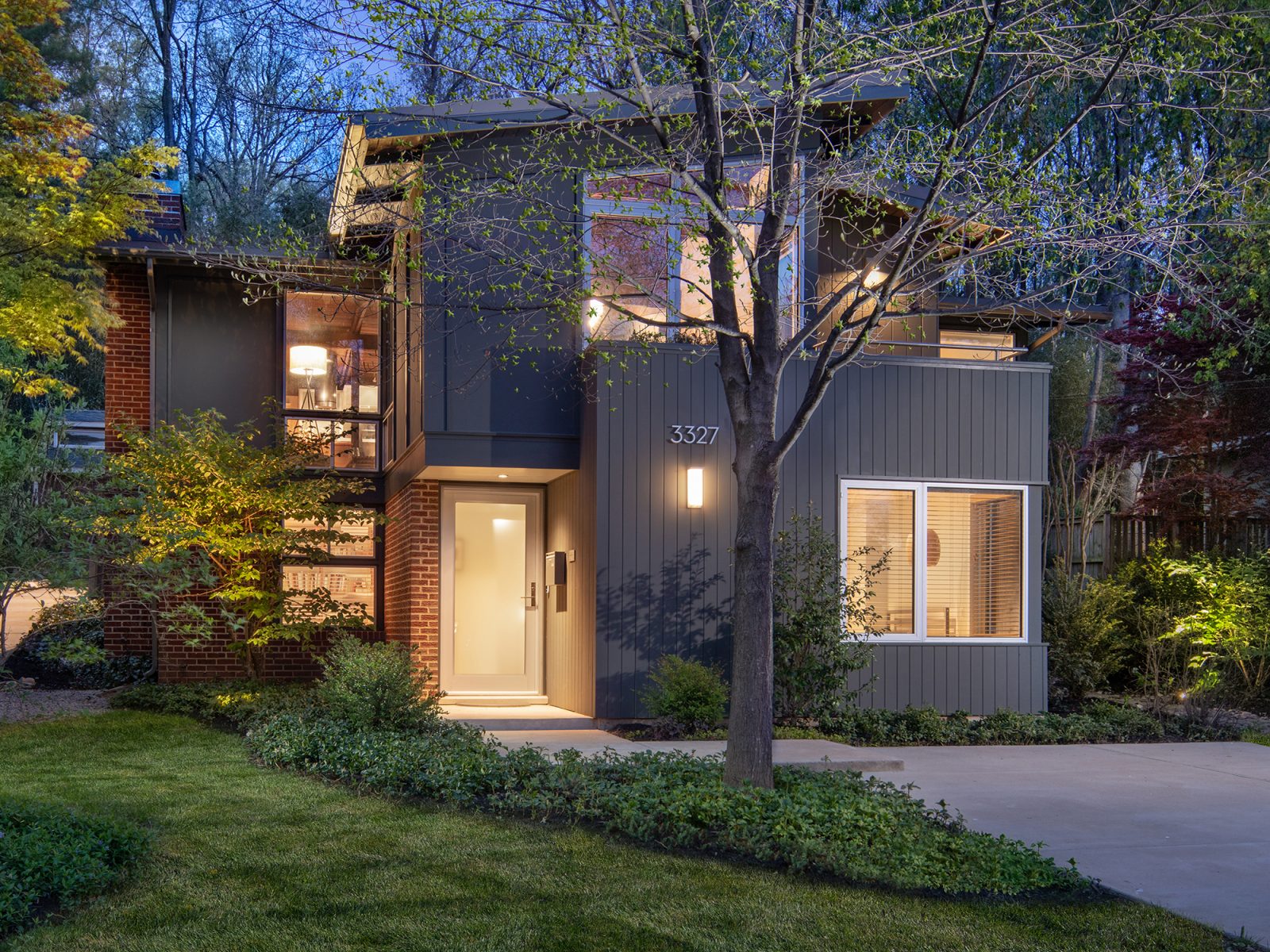 Street view of front elevation showing new home expansion for this home expansion