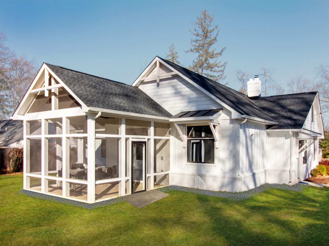 Exterior view of new rear home addition, screened-in-porch and exterior siding, window/trim and roofing replacement that has imbued this home with historic cottage character