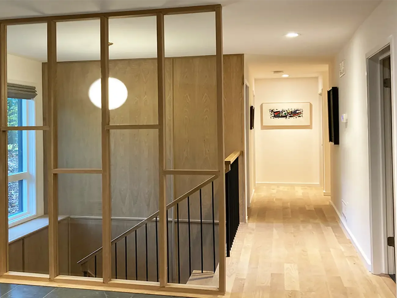 New light filled floating mid-century modern inspired stair and foyer