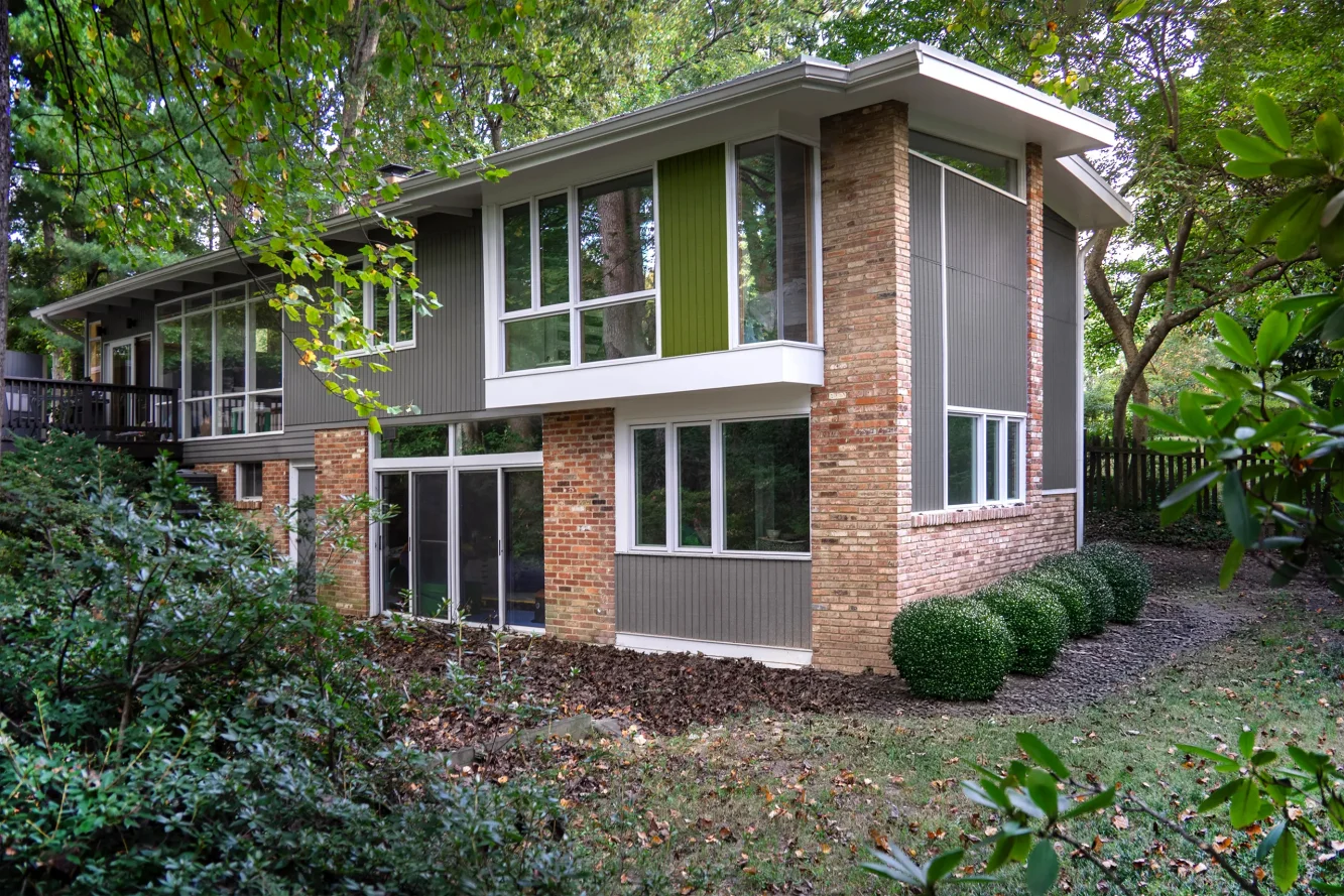 Exterior of mid-century modern home with new end of house addition